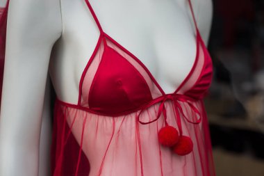 Closeup of red nighty on mannequin in a fashion store showroom