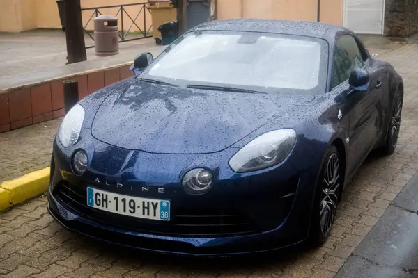 stock image Gruissan - France - 28 April 2024 - front view of marine blue Alpine A110 gt parked in the street