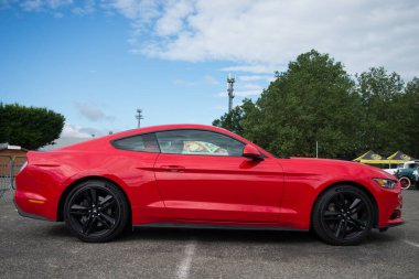 Illzach - France - 19 May 2024 - Profile view of red Ford mustang 500 GT parked in the street