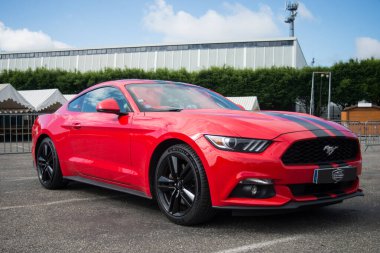 Illzach - France - 19 May 2024 - Profile view of red Ford mustang 500 GT parked in the street