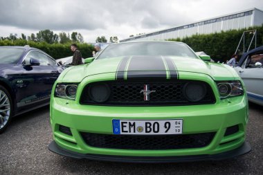Illzach - France - 19 May 2024 - Front view of green Ford mustang 500 GT parked in the street