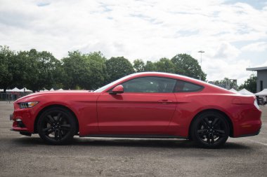 Illzach - France - 19 May 2024 - Profile view of red Ford mustang 500 GT parked in the street