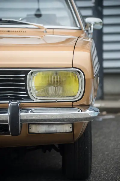 stock image Mulhouse - France - 9 June 2024 - front view of front light of brown chrysler car parked in the street