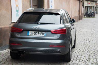 Strasbourg - France - 6 October 2024 - rear view of grey audi Q3 suv car parked in the street clipart