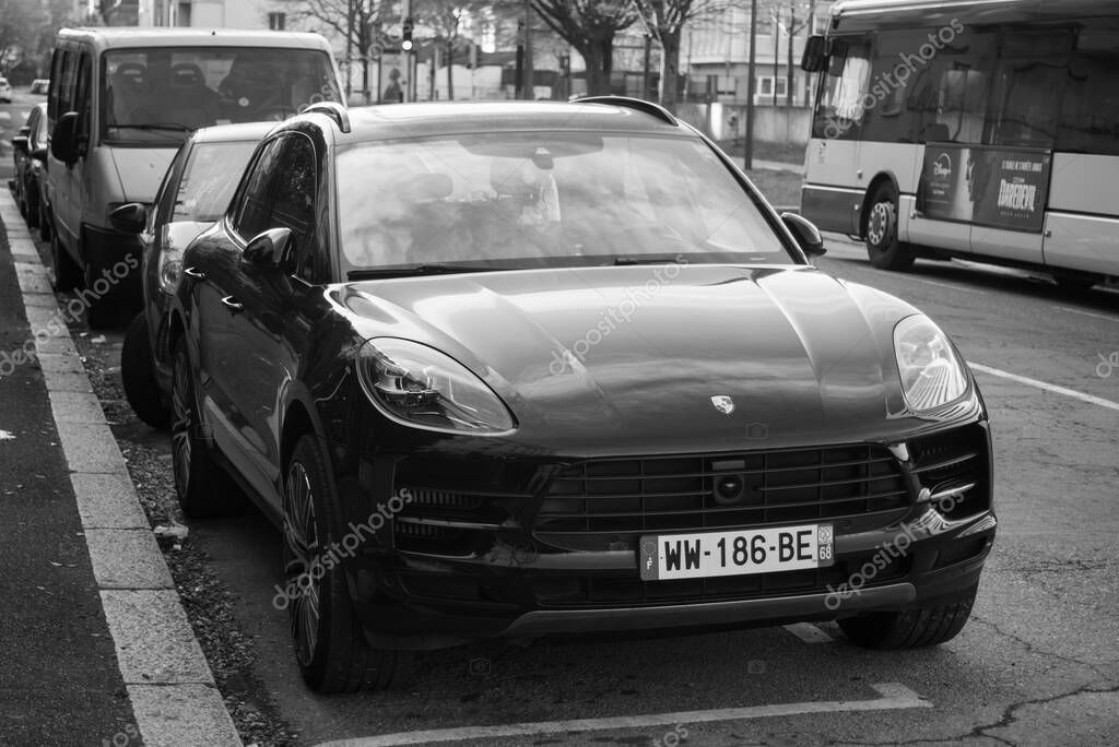 Mulhouse - France - 30 march 2025 - front view of black porsche cayenne parked in the street
