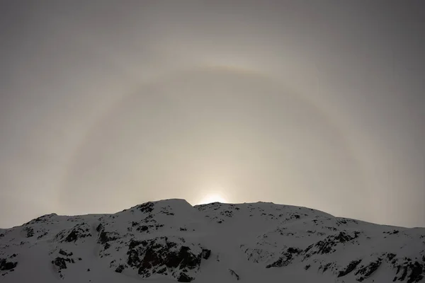 Halo efect an optical phenomenon. French alps in winter,  Rhone Alpes in France Europe. Les deux alpes Snowy alps mountains in Europe.