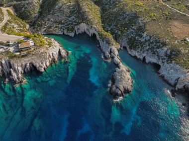 Porto Limnionas Beach Zakynthos Greece. Aerial drone View Of Porto Limnionas Beach In Zakynthos Island Greece. Vacation turquoise sea and green rock cliffs on the island. clipart