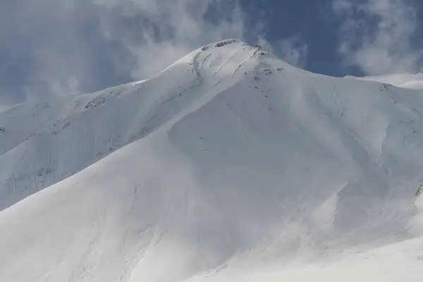 stock image  Kudebi, Bidara, Sadzele, Kobi aerial panorama in caucasus winter mountains. Aerial drone view of Gudauri ski resort in winter. Caucasus mountains in Georgia