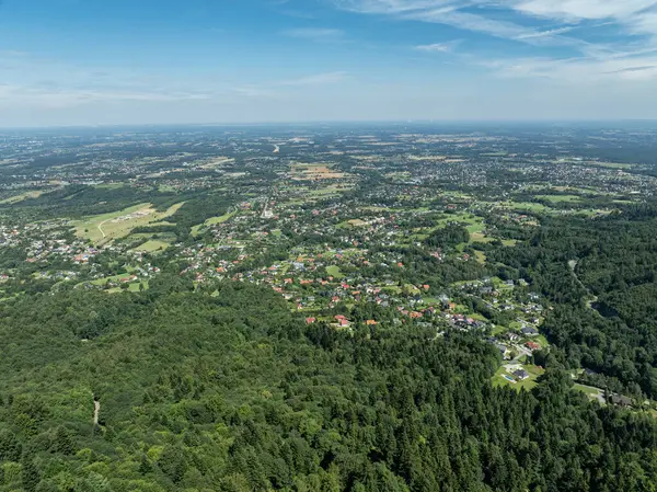 stock image Stunning aerial drone view of summer green forests in the Beskids, Bielsko Biala, Magurka Wilkowicka. Shelter on Magurka Wilkowicka. The landscape of the hills reflects the beauty and serenity of lush greenery. 