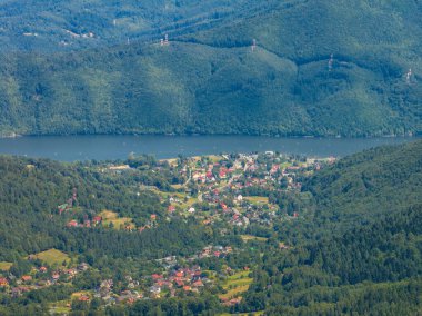 Stunning aerial drone view of summer green forests in the Beskids, Bielsko Biala, Magurka Wilkowicka. Shelter on Magurka Wilkowicka. The landscape of the hills reflects the beauty and serenity of lush greenery.  clipart