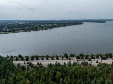 Aerial drone view of Lake Pogoria in Poland. lakes divided by railway tracks and a bicycle path. Lake Pogoria in Dabrowa Gornicza, Poland. clipart