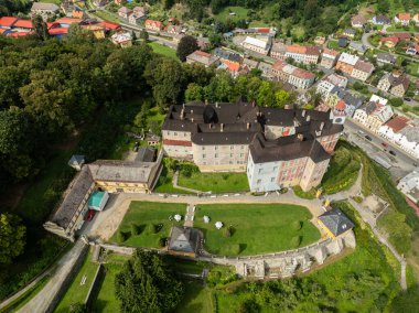 Jansky Vrch State Chateau on a rocky hill above the town of Javornik, located in the Czech Republic in Moravia. Javornik in summer drone fly.Aerial drone view of Castle Jansky Vrch in Javornik. clipart