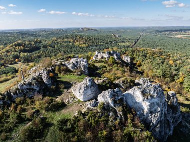 Polish Jurassic Highland Mountainl Zborow in autumn. Aerial drone view of Zborow Hill, Poland. Limestone rock formation at peak of Gora Zborow, Podlesice, Poland. Krakow-Czestochowa Upland clipart