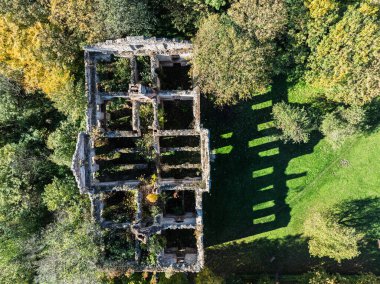 Aerial drone view of the palace in Wlodowice  ruined palace, located in Wlodowice. Abandoned palace seen from a drone. Abandoned palace without a roof. Wlodowice, Poland ruined palace. clipart