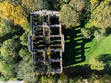 Aerial drone view of the palace in Wlodowice  ruined palace, located in Wlodowice. Abandoned palace seen from a drone. Abandoned palace without a roof. Wlodowice, Poland ruined palace. clipart