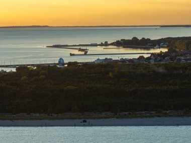 Hel city. Aerial view of Hel Peninsula in Poland, Baltic Sea and Puck Bay. Aerial video made by drone from above. End of poland hel peninsula. Hel beach in Poland. Sunset at sea and bay, Poland. clipart