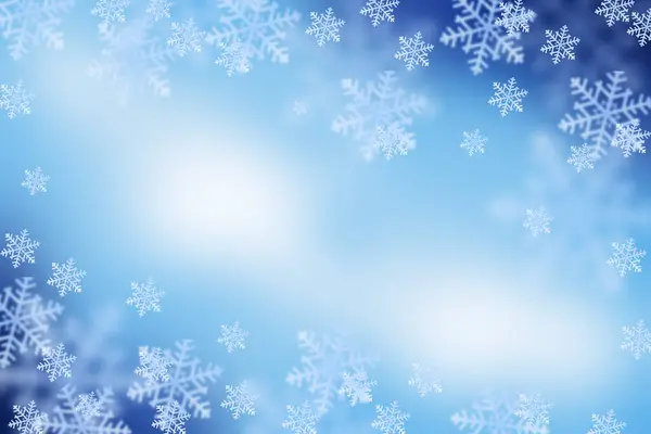 Kar taneleri ile Noel mavisi arka plan. Kışın büyülü atmosferi. Boşluğu kopyala.