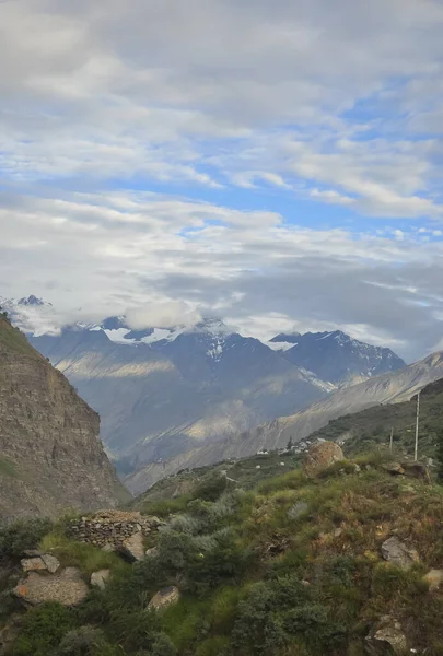 stock image Morning view of glacier mountains covered with clouds view from beautiful village in Lahaul and Spiti, Himachal Pradesh, India 