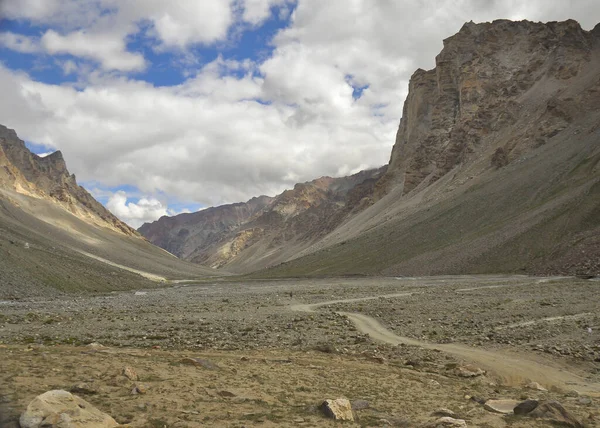 Landscape view of Rocky mountains of Ladakh with cloudy sky in summer season.