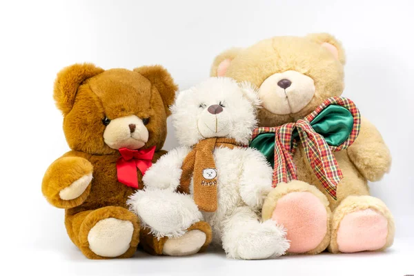 Three Teddy bears on a white background. Plush toys for kids.