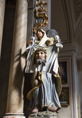 The sculpture in the church depicting the Veil of Veronica or Sudarium, also known as the Vernicle. clipart