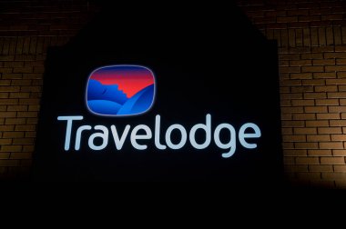 London, UK - March 23, 2024 : Travelodge sign at night. Travelodge Hotel in London. UK. clipart