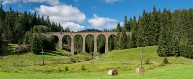 The Chmarossky Viaduct at Telgart village. Technical monument railroad bridge. Slovakia. clipart