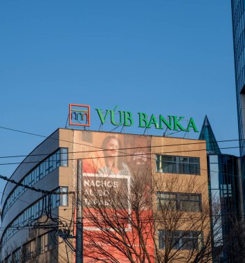 Bratislava, Slovakia - February, 22, 2025 : Sign of VUB bank on the building.  VUB is a part of Intesa Sanpaolo group. Vseobecna uverova banka logo. clipart