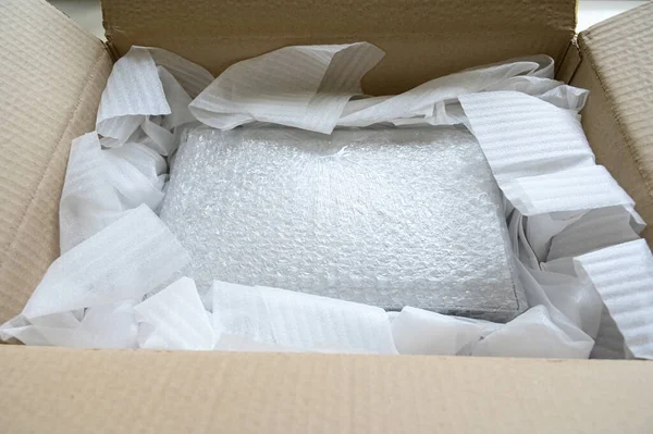 Bubble Wrap Packaging. Brown Box Stock Photo - Image of wrap