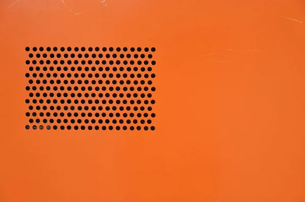 orange computer cpu texture background with black hole