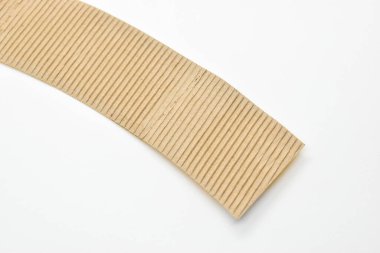 closeup brown paper cardboard texture on white background