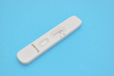 covid test kid on blue background