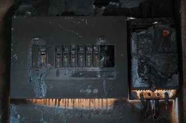 switchboard electricty burn on brick wall texture background