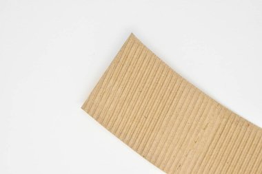 closeup brown paper cardboard texture on white background
