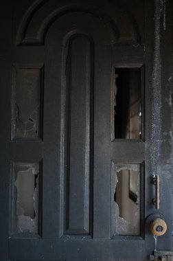 burn dirty wood door texture background and broken glass