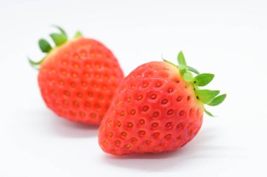 beautiful two fresh red strawberry isolated on white background