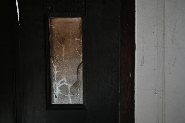 Burning Dirty Black Wood Door Broken Glass Texture Background — стоковое фото