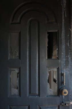 burn dirty wood door texture background and broken glass