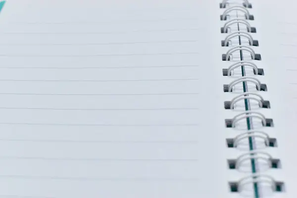 top view image of open notebook with blank page, lined paper texture background
