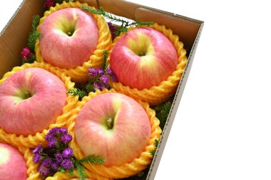 beautiful pink apple in the box on white background