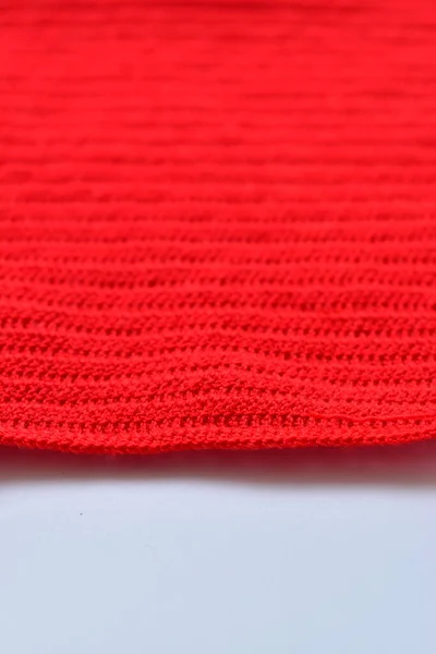 stock image red wool knitted yarn texture, woolen fabric on white background