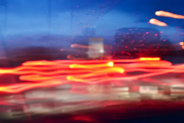 abstract light of car on road with accident in the night, blurred background