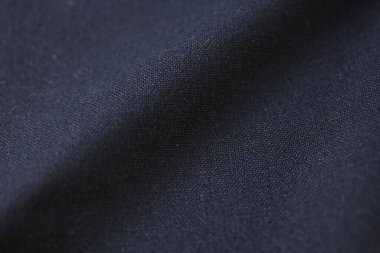Kumaş tekstil endüstrisinin siyah pamuk dokusu, moda bezi tasarımı için soyut koyu görüntü