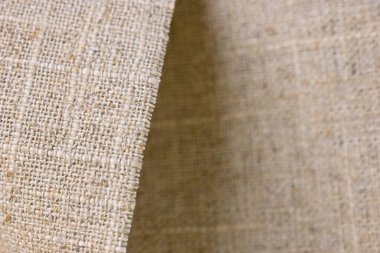 kahverengi kenevir doğal kumaş kumaş kumaş, tekstil modasının kaba dokusu soyut arkaplan