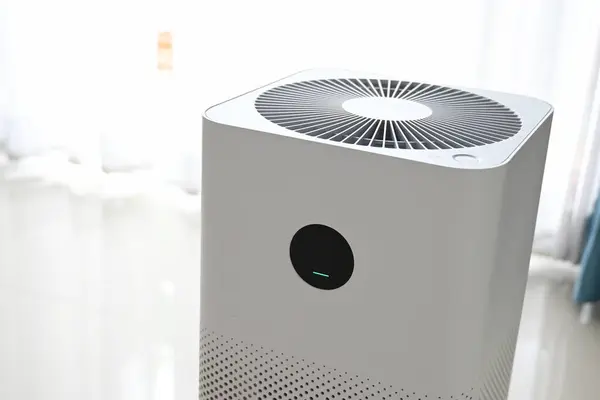 stock image air purifier technology clean dust pm 2.5 in living room inside home for healthy care of respiratory system