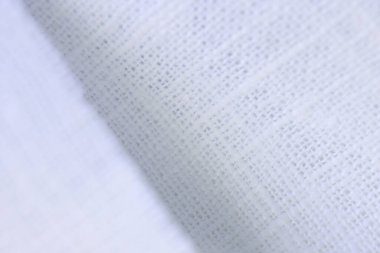 Beyaz kenevir doğal kumaş kumaş kumaş, tekstil modasının kaba dokusu soyut arkaplan