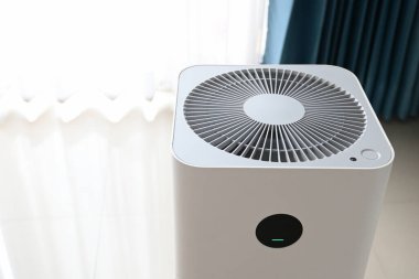 air purifier technology clean dust pm 2.5 in living room inside home for healthy care of respiratory system clipart