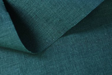 Yeşil kenevir doğal kumaş kumaş rengi, tekstil modasının kaba dokusu soyut arkaplan