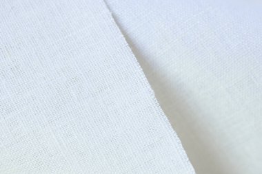 Beyaz krem kenevir doğal kumaş kumaş rengi, tekstil modasının kaba dokusu soyut arka plan
