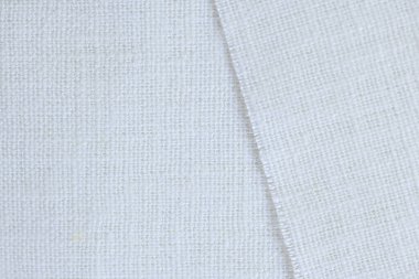 Beyaz krem kenevir doğal kumaş kumaş rengi, tekstil modasının kaba dokusu soyut arka plan